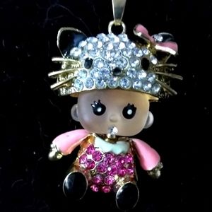 Baby Girl Wearing Hello Kitty Hat Pendant Necklace